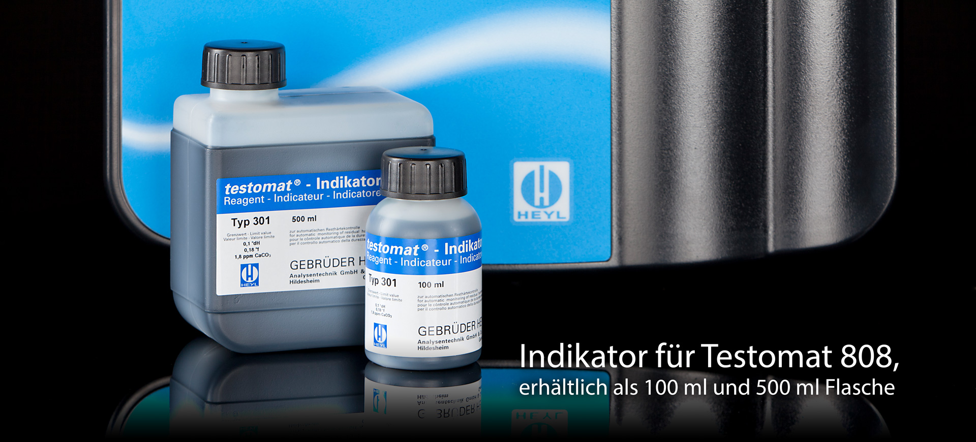 Ein Slider für den Indikator für Testomat 808, auf dem Foto ein Indikator 500 ml mit einem 100ml drauf, im Hintergrund ein Testomat 808 abgebildet. Schwarzes Hintergrund